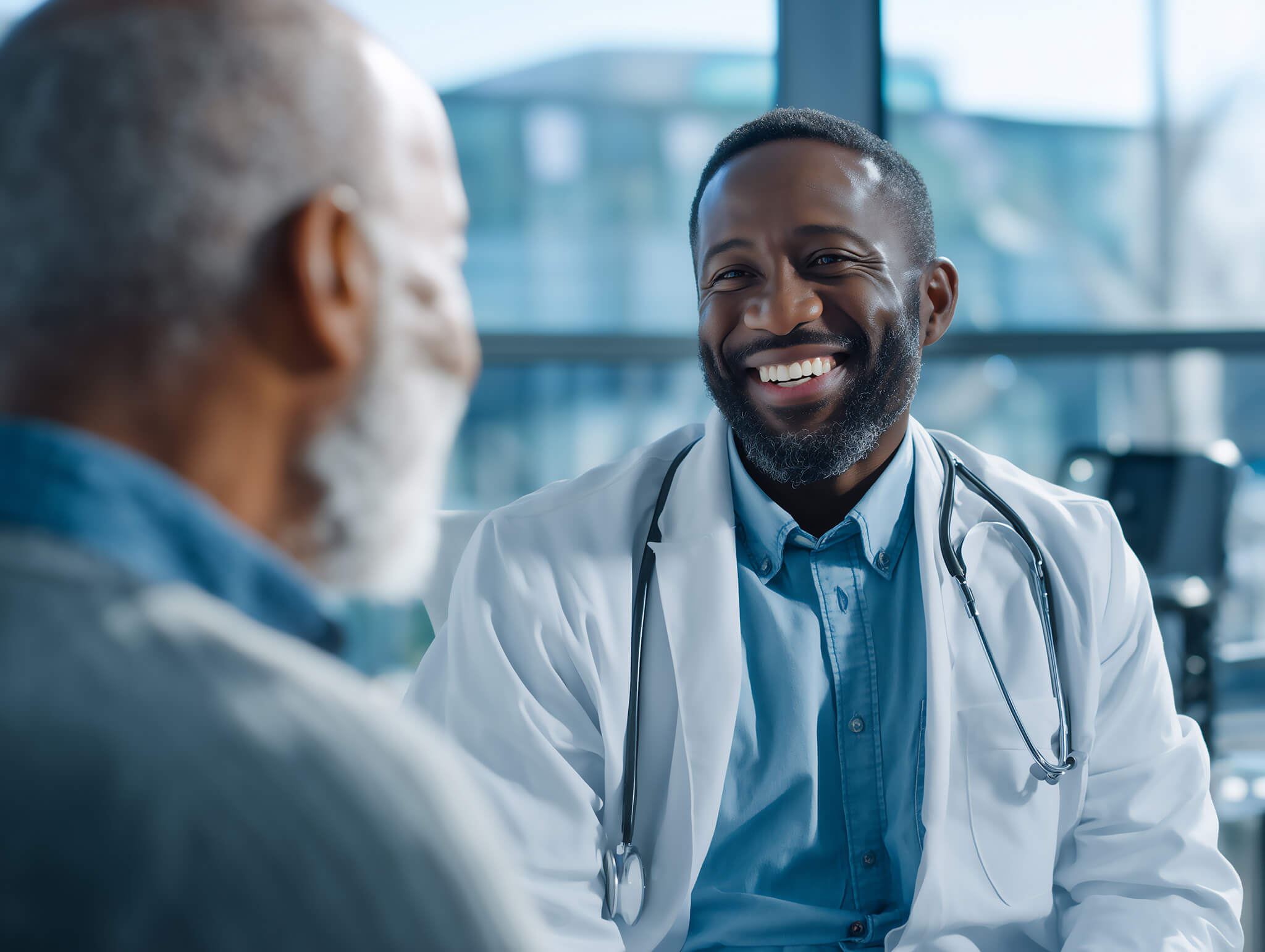 Smiling doctor engages with senior patient